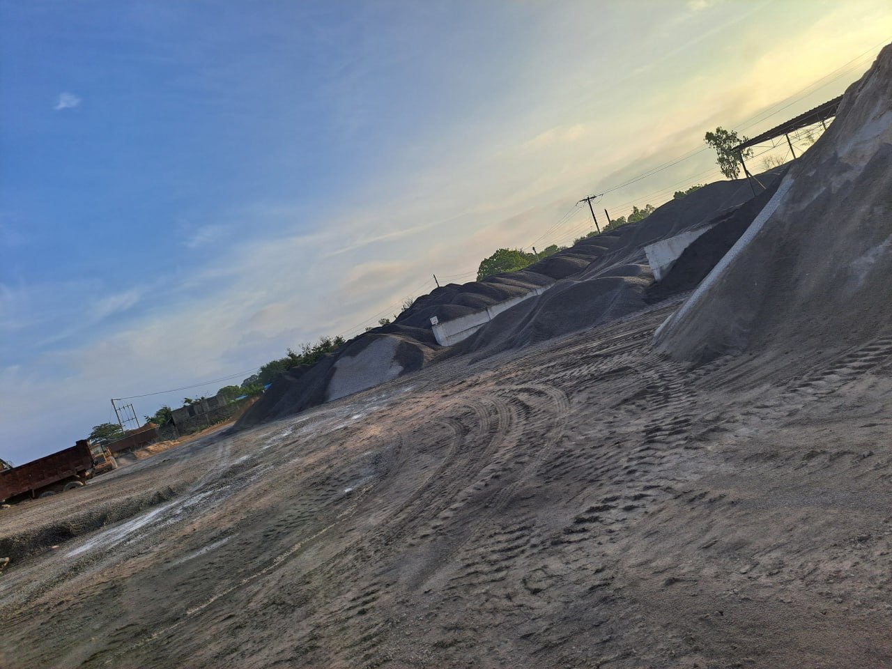 Evening view across the Jaribuni quarry stockyard